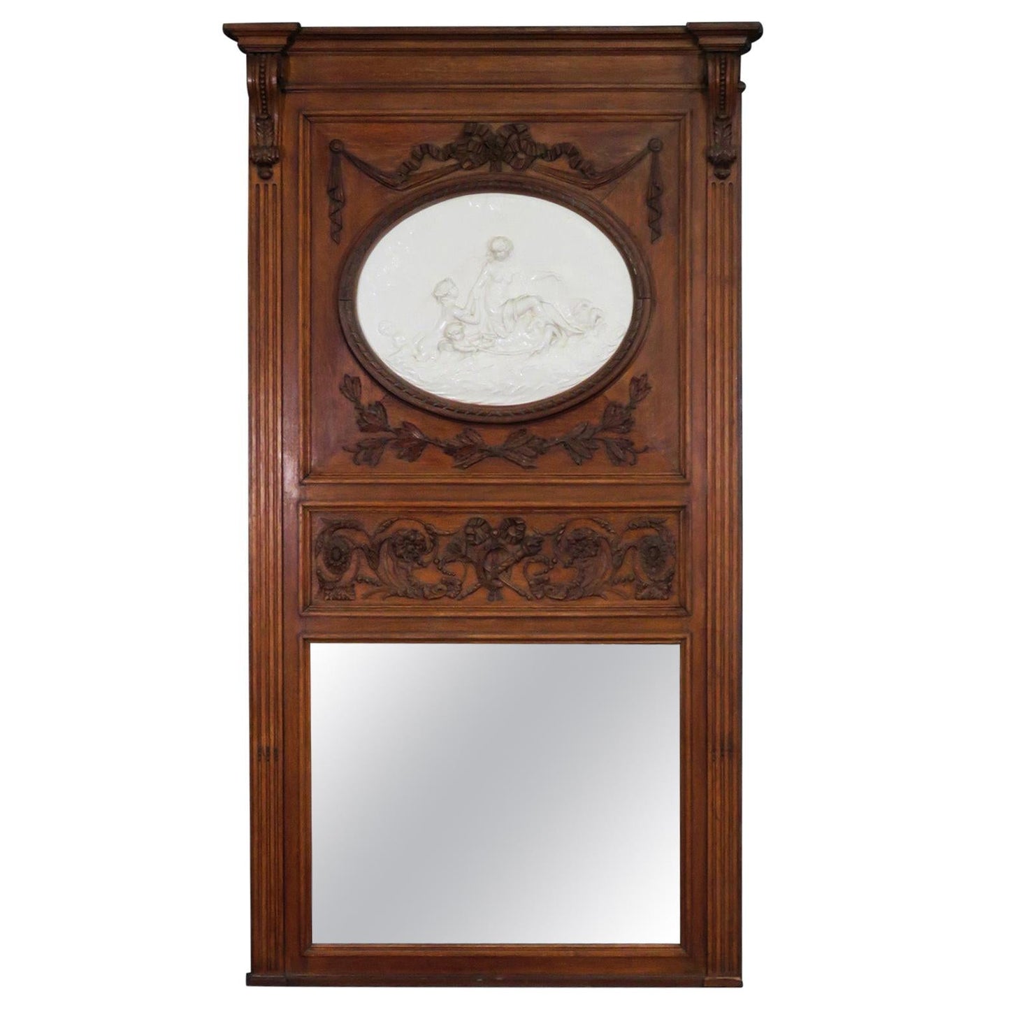 French Carved Walnut Tall Trumeau Mirror with Plaster Cherub Plaque, circa 1860s