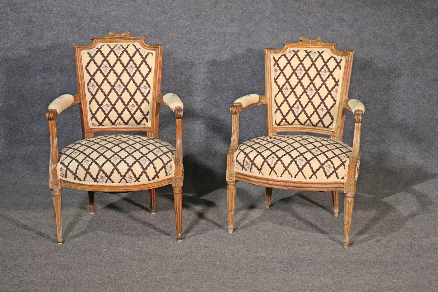 Companion Pair of Nearly Identical French Louis XVI Armchairs, Circa 1900