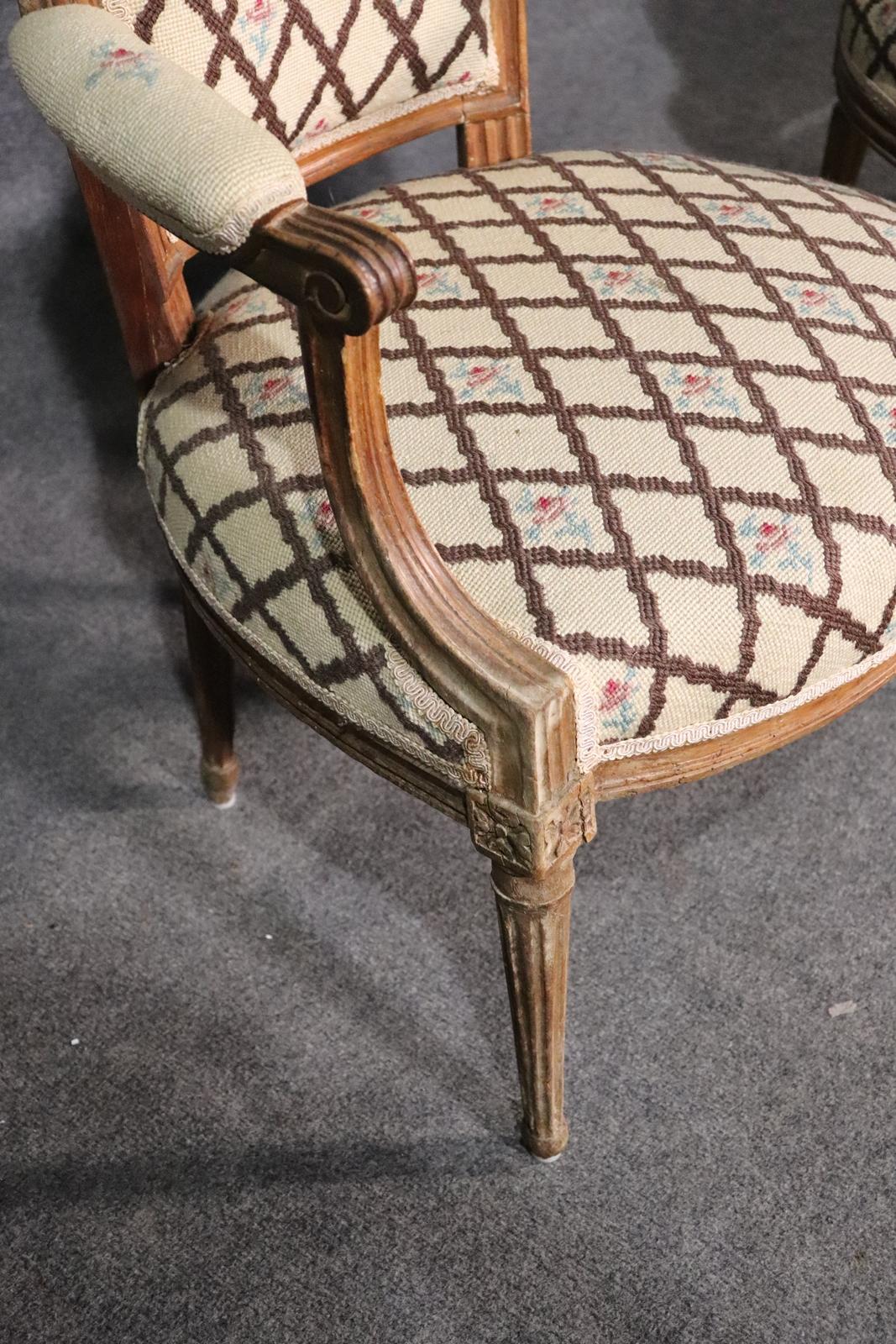 Companion Pair of Nearly Identical French Louis XVI Armchairs, Circa 1900