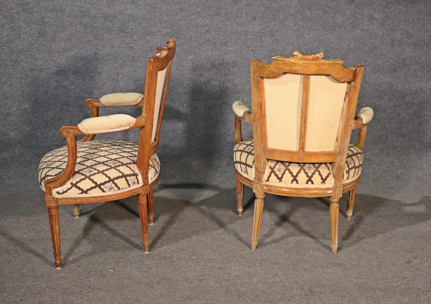 Companion Pair of Nearly Identical French Louis XVI Armchairs, Circa 1900