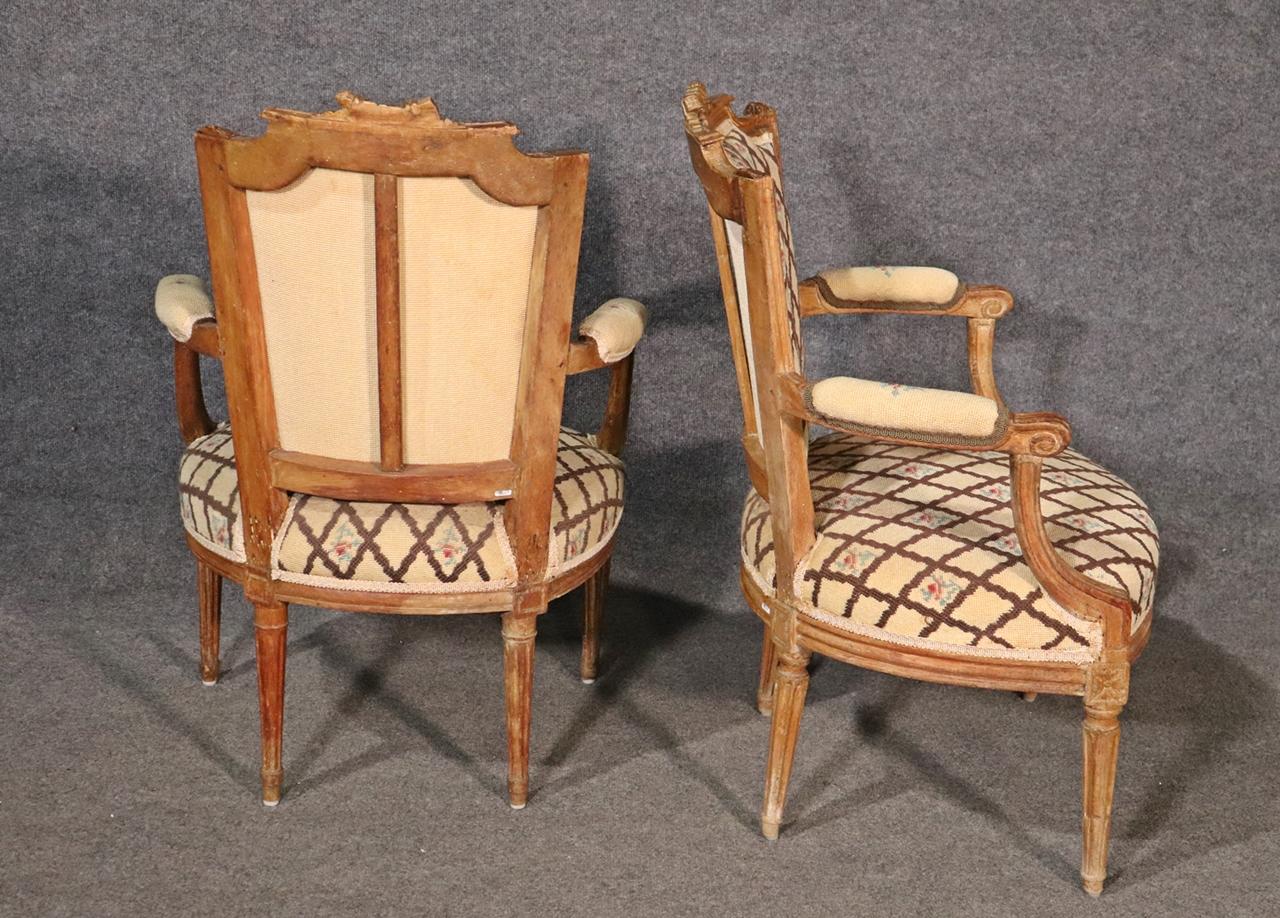 Companion Pair of Nearly Identical French Louis XVI Armchairs, Circa 1900