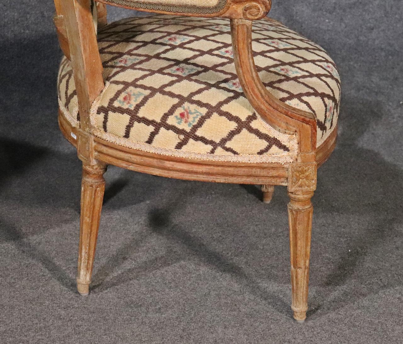 Companion Pair of Nearly Identical French Louis XVI Armchairs, Circa 1900