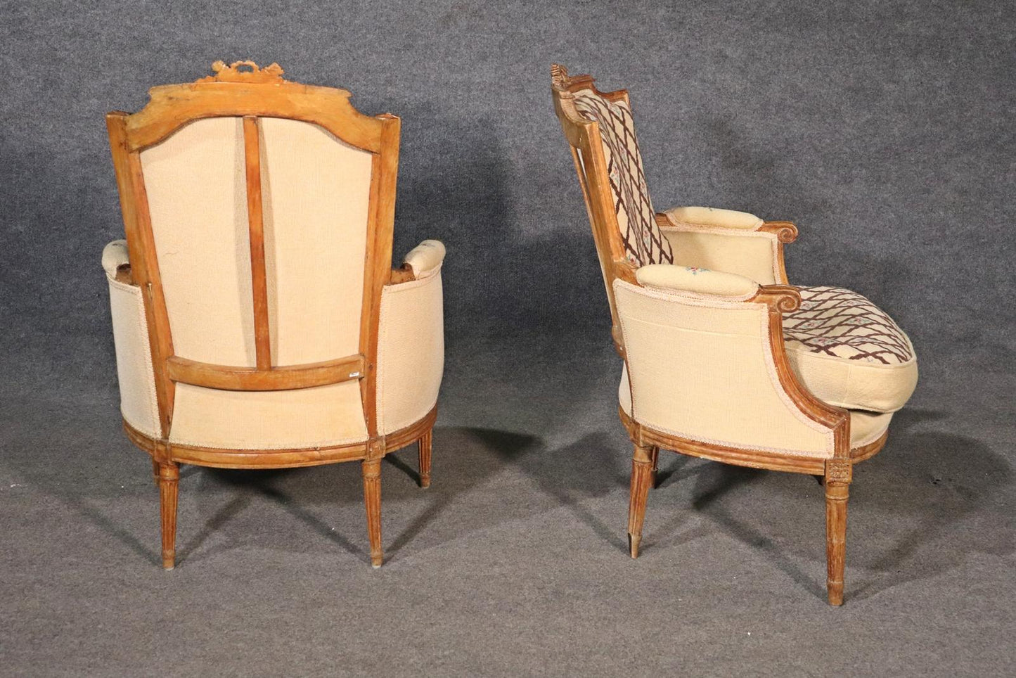 Companion Pair of Nearly Identical French Louis XVI Armchairs, Circa 1900