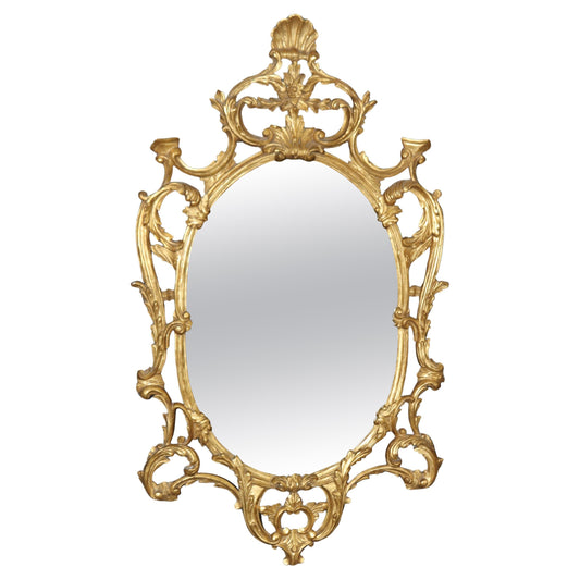 Fine Quality Carved Italian Giltwood Mirror with Shell Motif Atop.