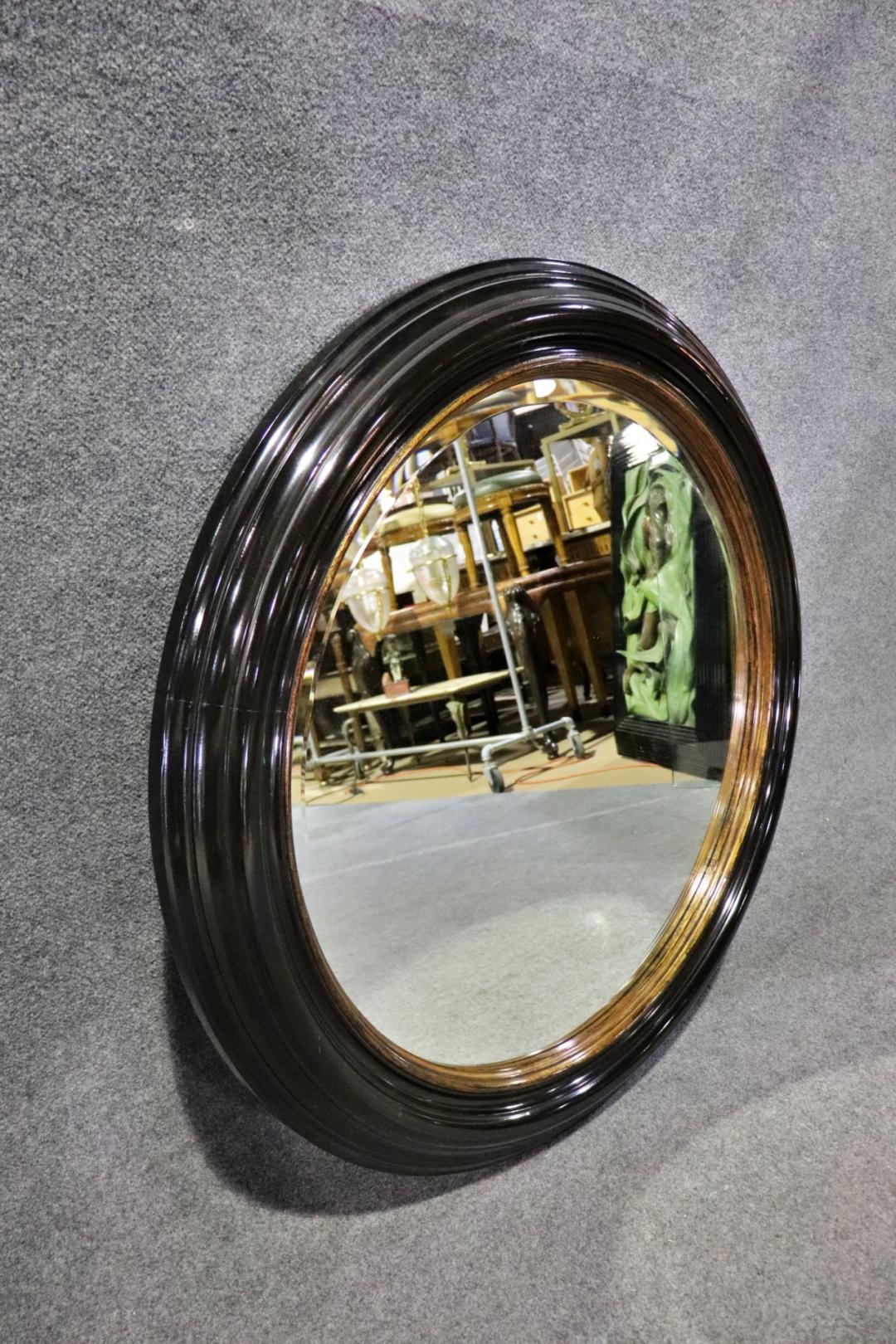 Great Milling Road by Baker Large Ebonized Circular Gilded Wall Mirror