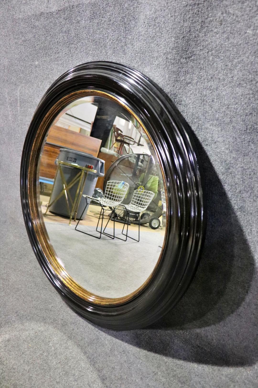 Great Milling Road by Baker Large Ebonized Circular Gilded Wall Mirror