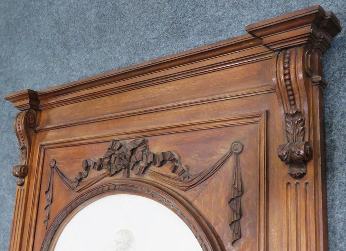 French Carved Walnut Tall Trumeau Mirror with Plaster Cherub Plaque, circa 1860s