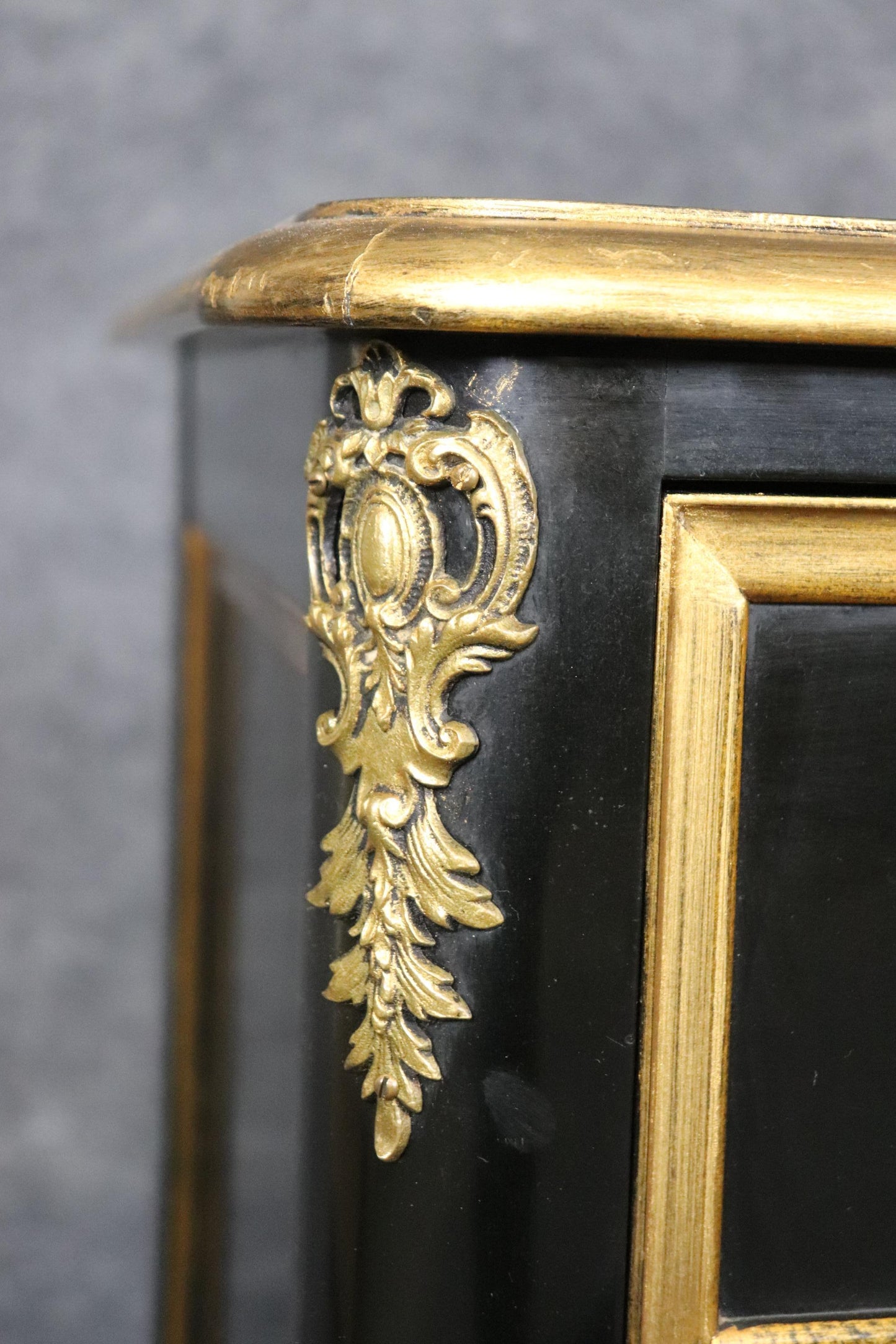 Matched Pair of Maison Jansen style Ebonized and Gilded Louis XV Commodes