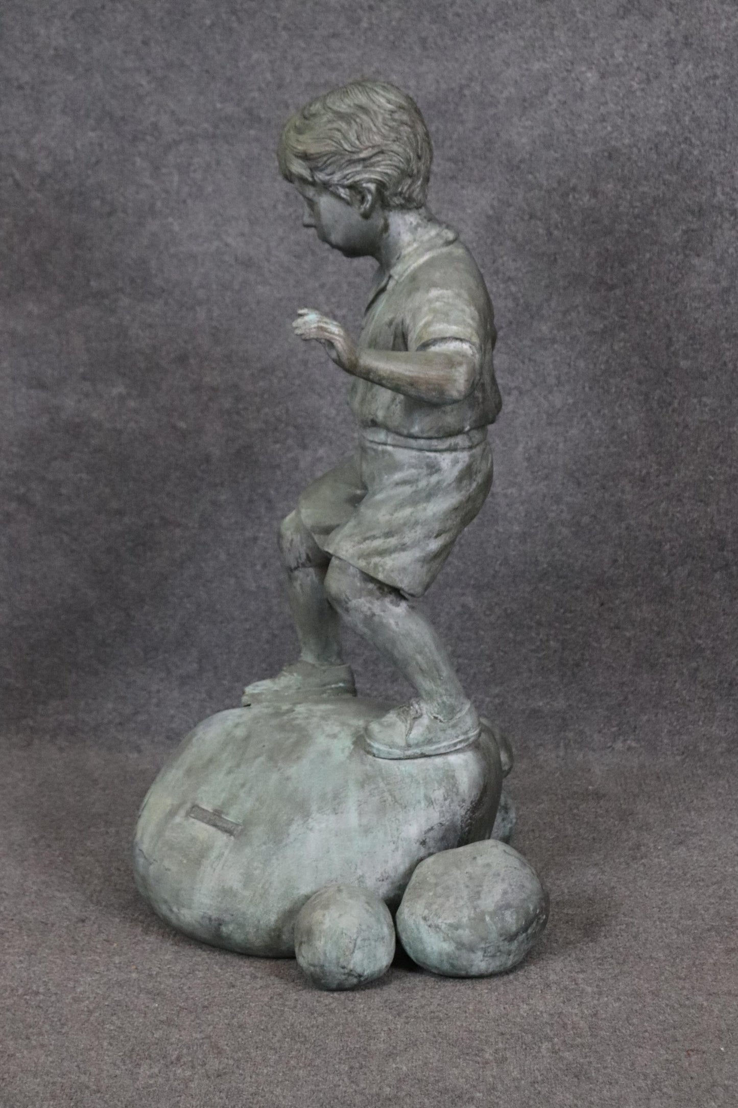 Bronze Elite by Henre in Verdi Gris Outdoor Statue of a Young Boy on a Rock