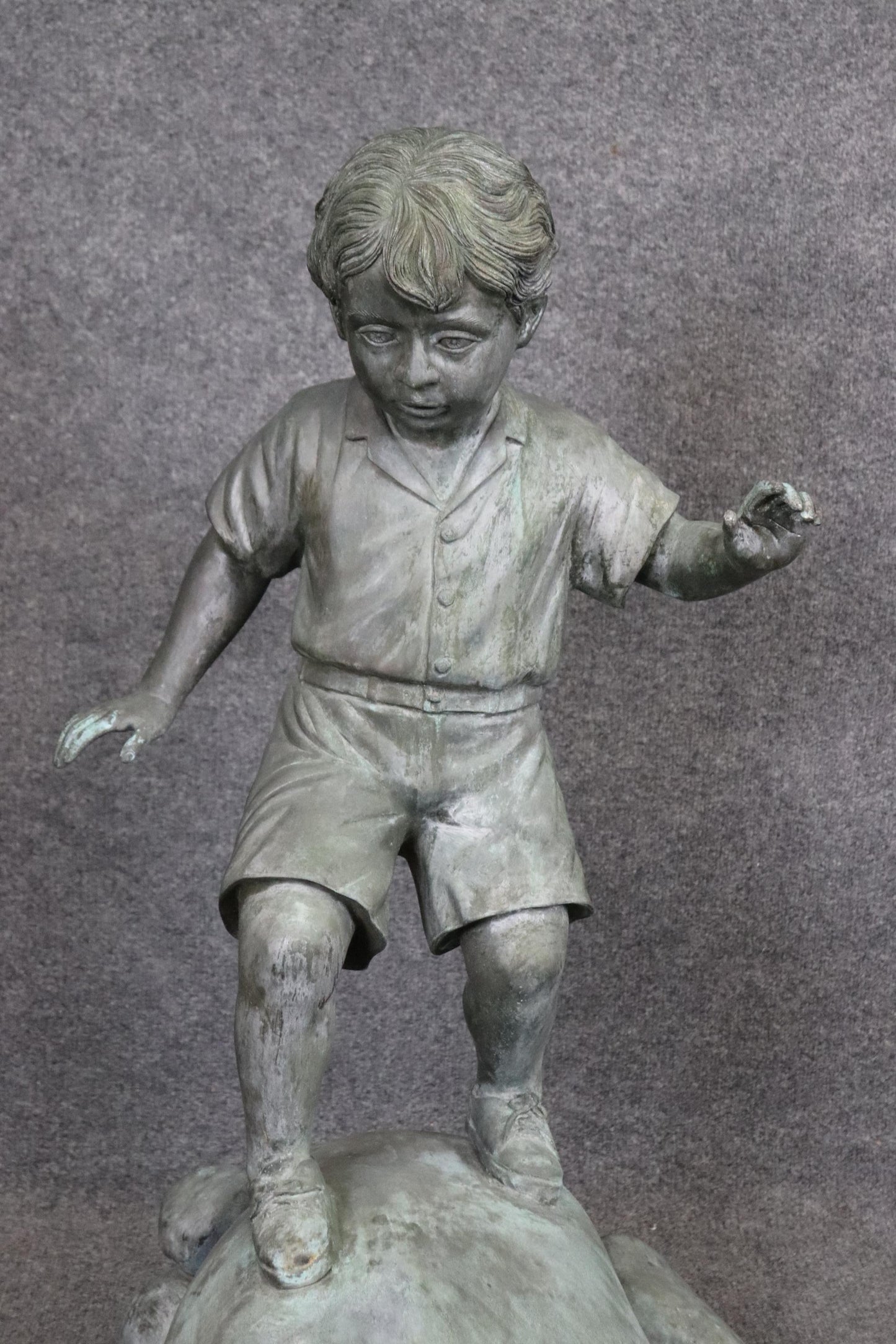 Bronze Elite by Henre in Verdi Gris Outdoor Statue of a Young Boy on a Rock