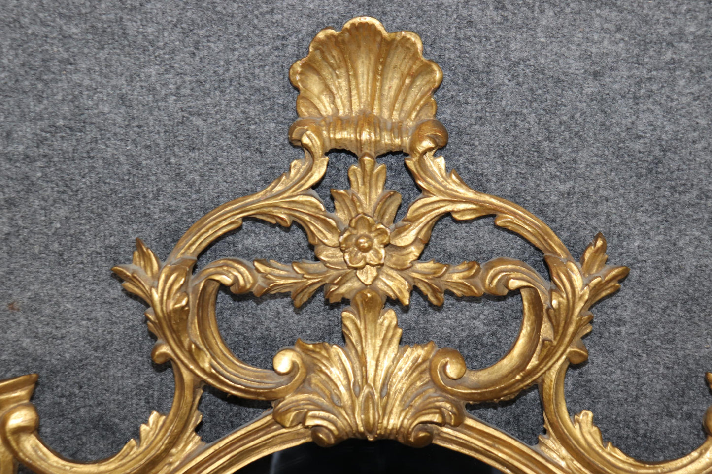 Fine Quality Carved Italian Giltwood Mirror with Shell Motif Atop.