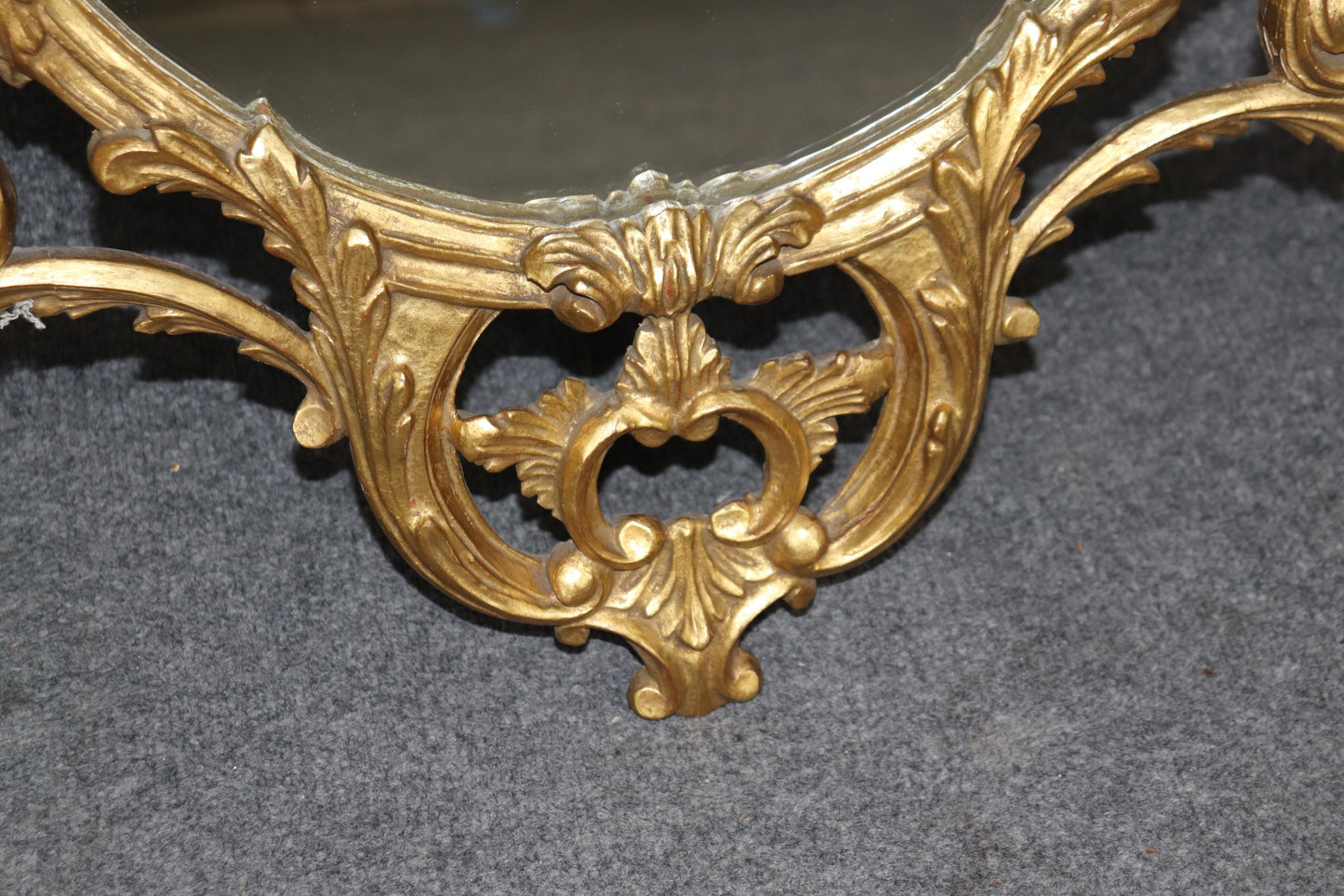 Fine Quality Carved Italian Giltwood Mirror with Shell Motif Atop.