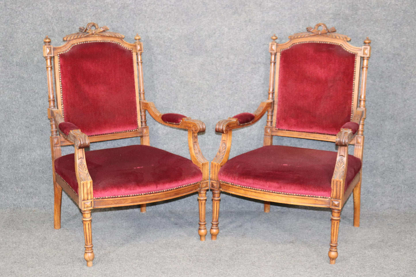 Pair of Carved Walnut Burgundy Velvet Louis XVI Fauteuil Armchairs, circa 1920