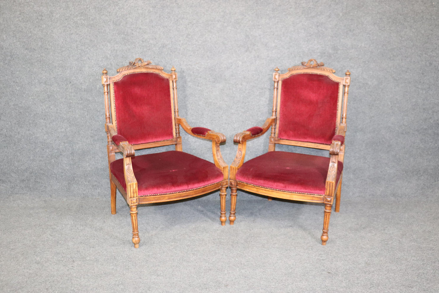 Pair of Carved Walnut Burgundy Velvet Louis XVI Fauteuil Armchairs, circa 1920