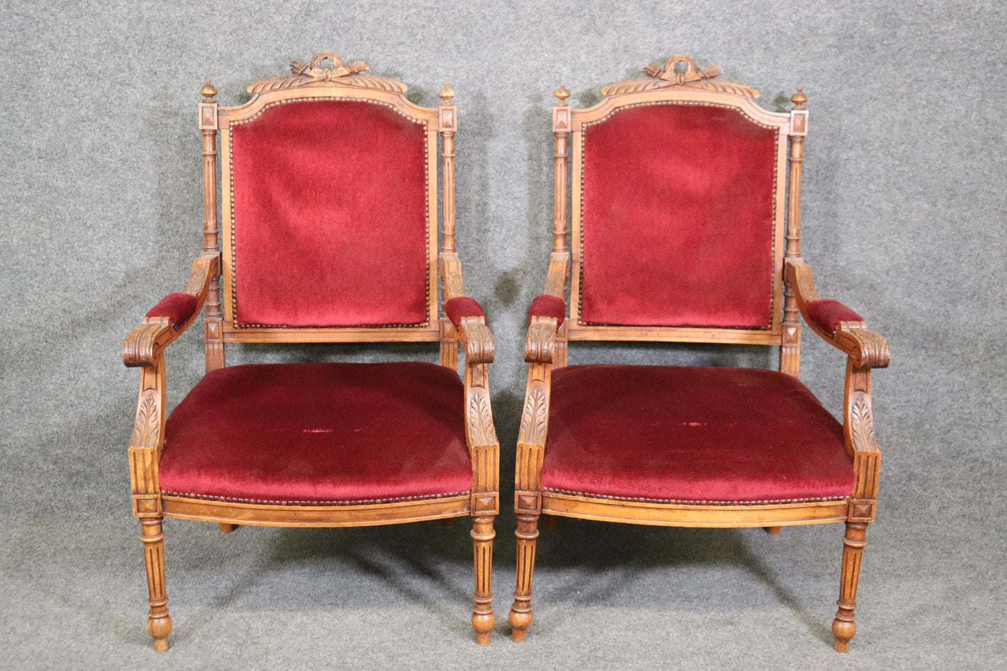 Pair of Carved Walnut Burgundy Velvet Louis XVI Fauteuil Armchairs, circa 1920