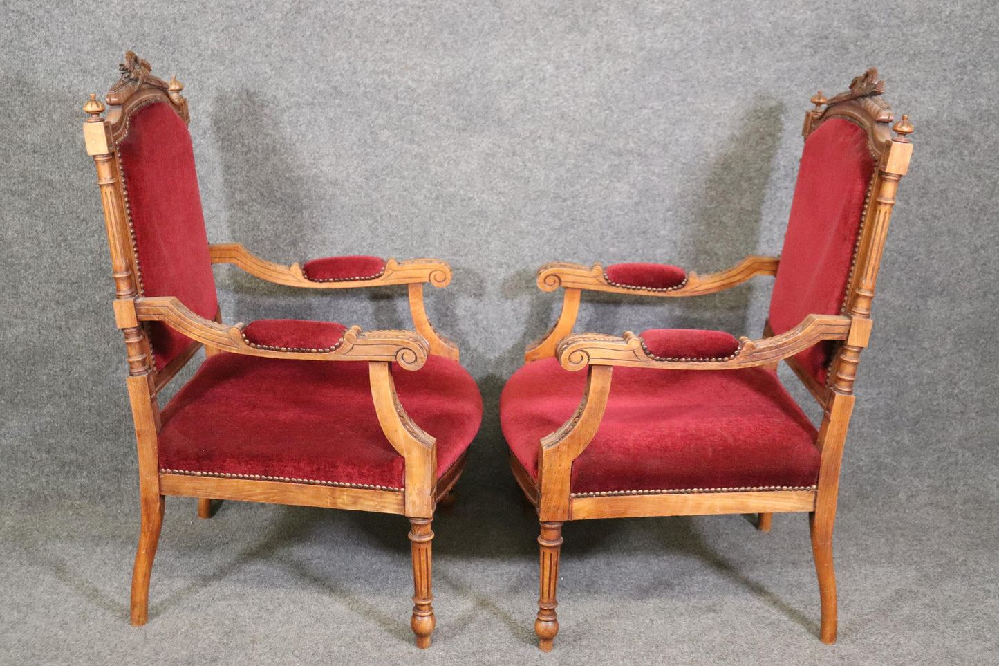 Pair of Carved Walnut Burgundy Velvet Louis XVI Fauteuil Armchairs, circa 1920