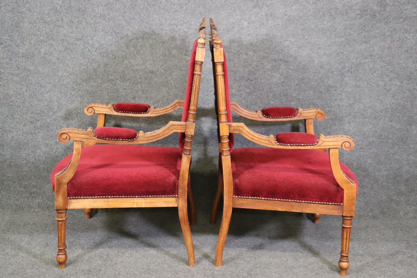 Pair of Carved Walnut Burgundy Velvet Louis XVI Fauteuil Armchairs, circa 1920