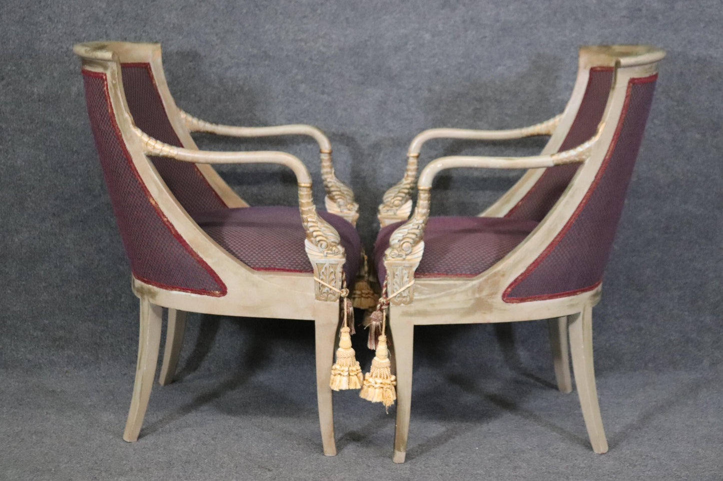 Pair of Paint Decorated and Gilded Dolphin Head Neoclassical Bergere Chairs