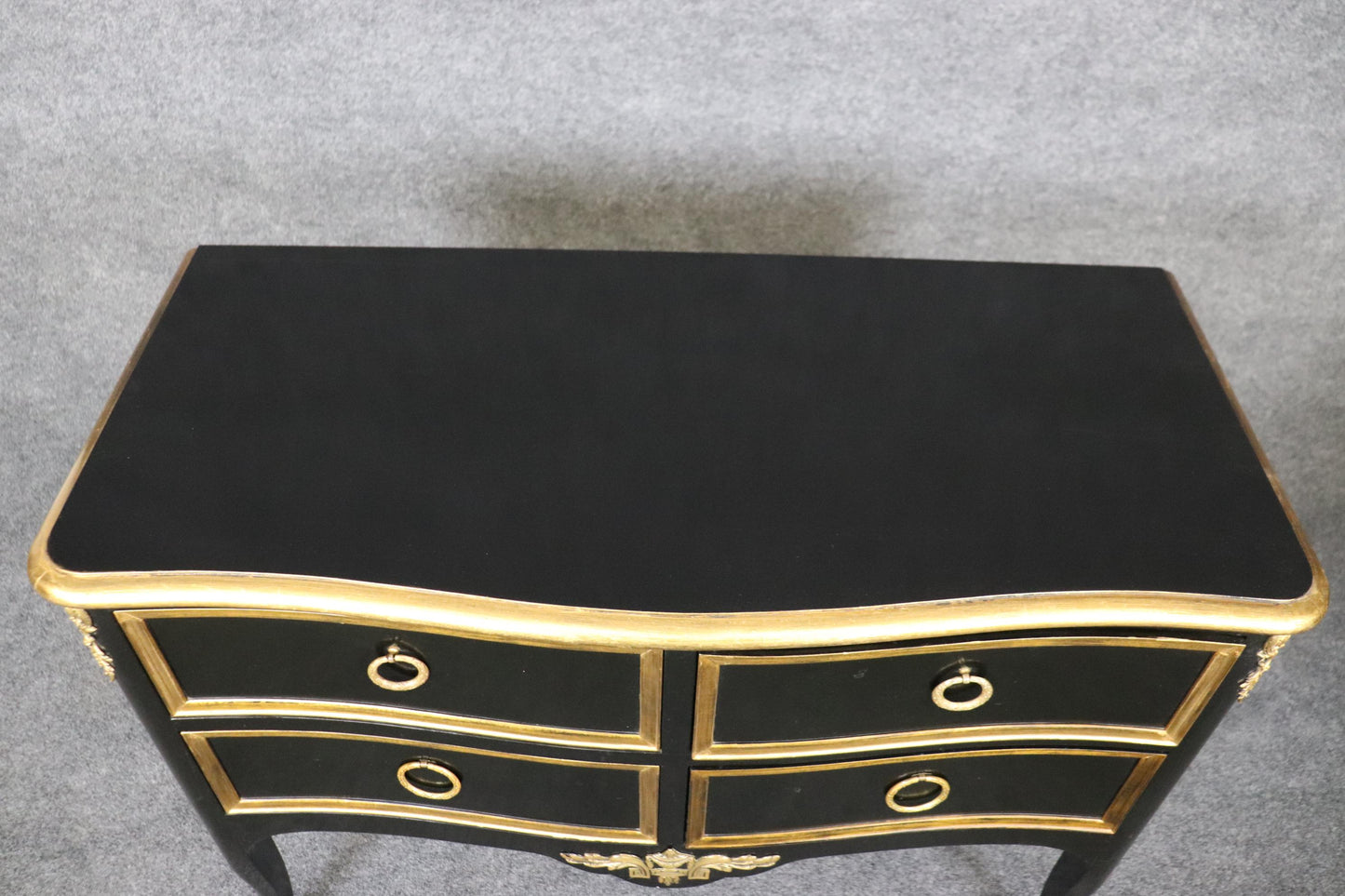 Matched Pair of Maison Jansen style Ebonized and Gilded Louis XV Commodes