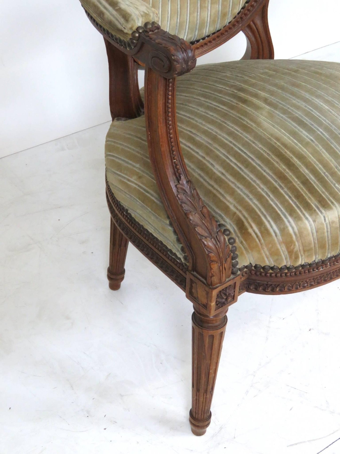 Pair of Antique Louis XVI Style Carved Walnut Fauteuils